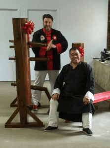 GM Mauricio donating Wooden Dummies to Grandmaster Felix Leong in Adelaide